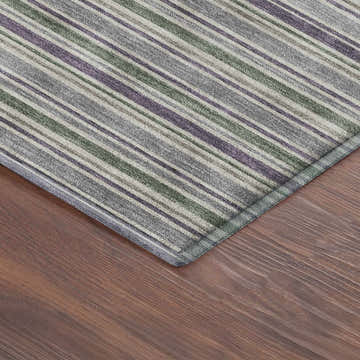 Close-up of Dalyn Luxury Soft Essentials SE2 Pewter Washable Area Rug. Striped design in medium gray, green, and purple hues.