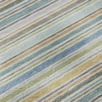 Close-up of Dalyn Luxury Soft Essentials Seaside rug featuring a striped pattern in blue, green, brown, and gray.