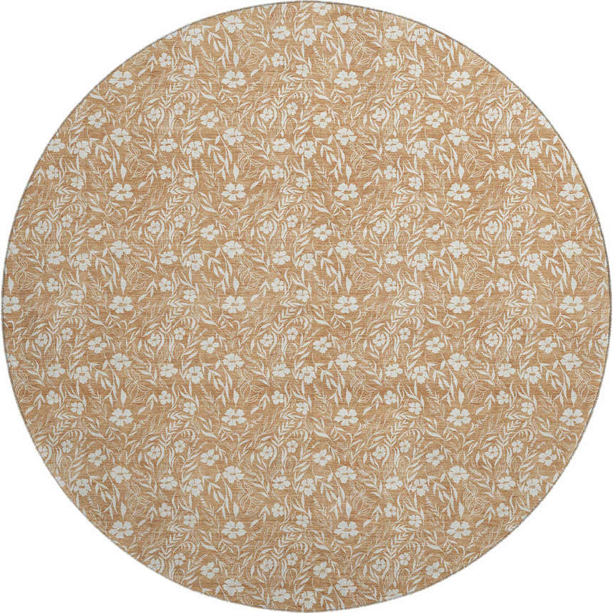 Close-up of a round Dalyn Luxury Soft Essentials rug in caramel with a white floral and leaf pattern.
