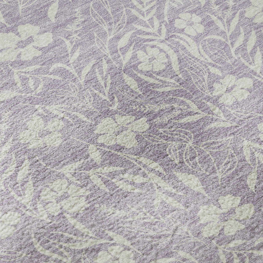Close-up of the Dalyn Luxury Soft Essentials SE4 Lavender rug. Floral pattern in soft white on a textured purple background.