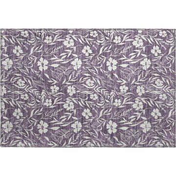 Close-up of a Dalyn Luxury Purple Washable Area Rug. Features a floral pattern with white flowers and leaves on a purple background.