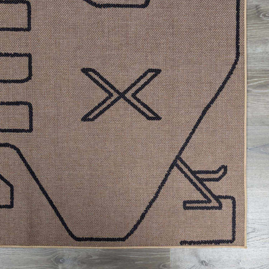 Close-up of the Hamid Washable Jutely Rug. Camel jute rug with a dark brown geometric pattern. Swatch