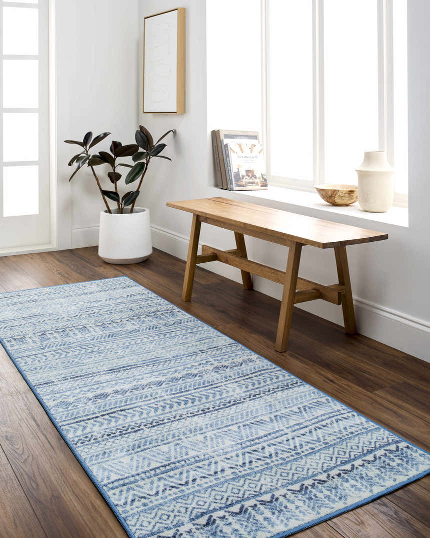 Entryway with Ianna Arctic Stone Washable Area Rug runner, wood bench, plant, and bright natural light. Farmhouse style. Roomscene-Runner