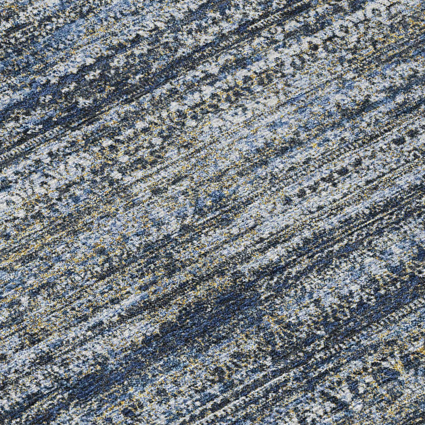 Close-up of the Dalyn Luxury Solace SL3 Denim Washable Area Rug. Features beige, denim, and light brown hues.