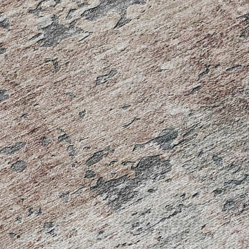 Close-up of the Dalyn Luxury Solace SL5 Gray Washable Area Rug. Beige, blush pink, and taupe tones with a textured pattern.