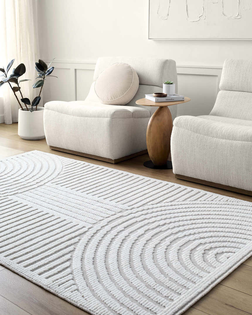 Living room scene with two white chairs and the Deron Ivory 3D Rainbow Washable Rug on a wood floor. Roomscene-Rectangle