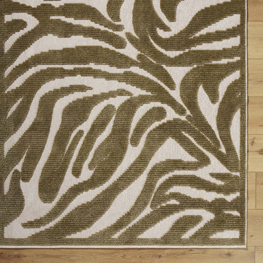 Close-up of the Keto Olive Washable Area Rug showing its off white and olive contemporary pattern and machine woven texture. Corner