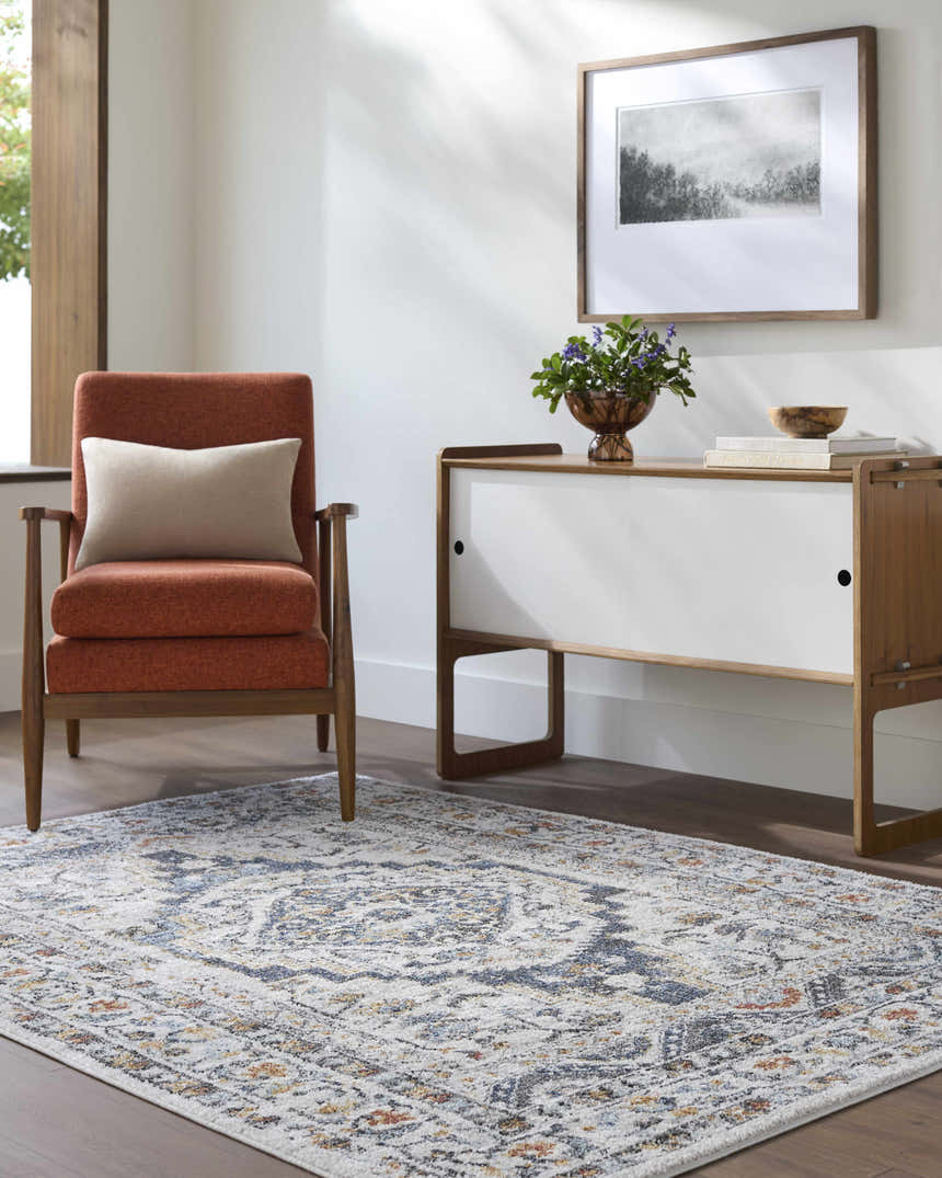 Living room scene with rust chair and Paula Off White Area Rug, featuring charcoal, brown, mustard, rust, and sage accents. Roomscene-Rectangle