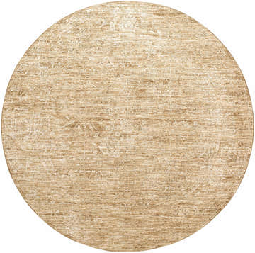 Close-up of a round Kyran Tan Area Rug. Khaki and tan tones with a subtle, distressed pattern. Design-Round-67