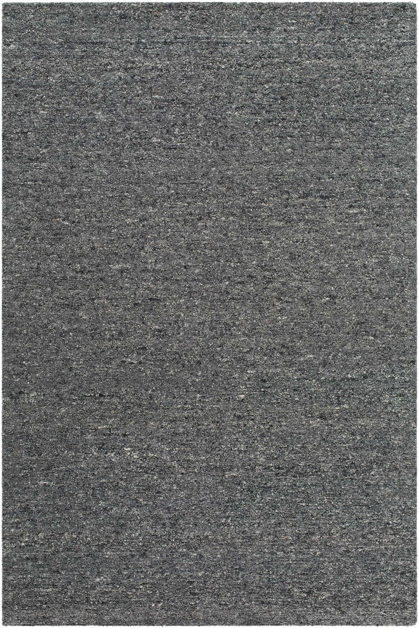 Detailed texture of the Sevan Charcoal Wool Area Rug, a hand-tufted rug in shades of black, gray, and steel gray. Design-Rectangle-576