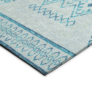 Close up of Dalyn Sedona SN14 Sky Washable Area Rug, featuring a geometric pattern in denim, light blue, and sky blue hues.