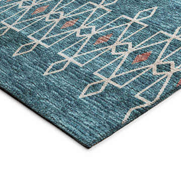 Close up of the Dalyn Sedona SN3 Riverview rug. Navy, paprika, and putty geometric pattern on a textured polyester rug.