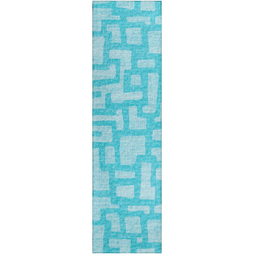Close-up of the Robins Egg Dalyn Sedona rug. Teal and light blue geometric pattern. Washable, indoor/outdoor rug.