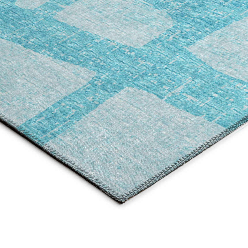 Close-up of Dalyn Sedona SN4 Robins Egg rug. Teal and robin's egg blue geometric pattern. Machine-made, washable rug.