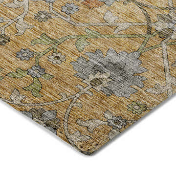 Close-up of the Dalyn Silk Road SR1 Saffron Area Rug. Caramel, gold, and green floral pattern.