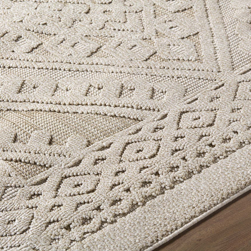 Close up of the neutral-toned Hibah Bone Area Rug featuring a contemporary geometric pattern. Texture
