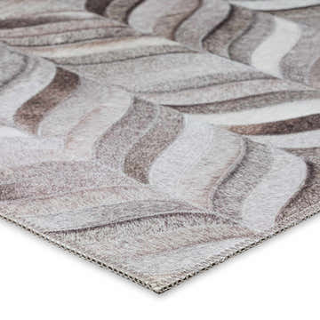 Close-up of the Dalyn Durango SS11 Flannel Washable Area Rug. Beige, brown, and taupe wavy pattern, soft texture.