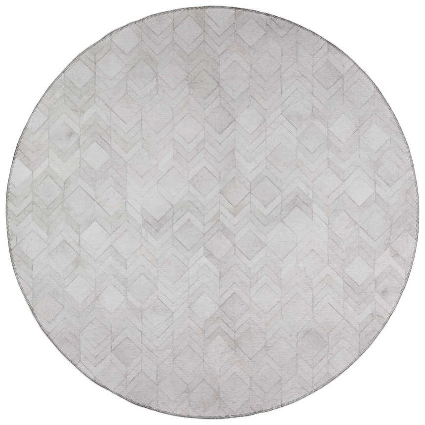 Close-up of round Dalyn Durango SS5 Linen Washable Area Rug. Beige rug features a geometric diamond and chevron pattern.