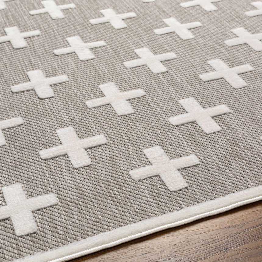 Close-up of Alvar SFG-2341 area rug. Contemporary design with a dark gray woven texture and raised white cross pattern. Texture
