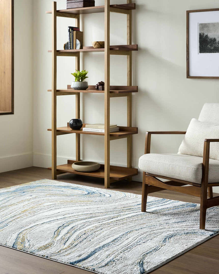 Living room scene with a Gregg Silver Gray Marble Area Rug, wood shelving, and mid-century modern chair. Roomscene-Rectangle