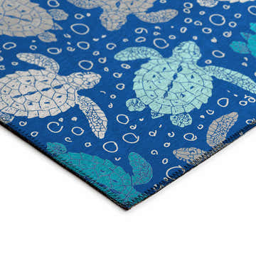 Close-up of Dalyn Seabreeze Navy Washable Area Rug with turtle and bubble design in navy, teal, and silver gray.