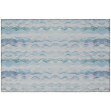 Close-up of Dalyn Seabreeze SZ16 Denim Washable Area Rug. Coastal style with blue wave pattern and serged edges.