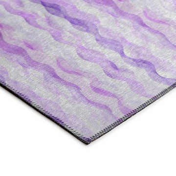 Close-up of Dalyn Seabreeze SZ16 Violet Washable Area Rug. Features a wavy, watercolor-like pattern in shades of purple.