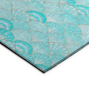 Close up of Dalyn Seabreeze SZ2 Teal Washable Area Rug featuring a teal and gold scallop pattern and machine-made construction.