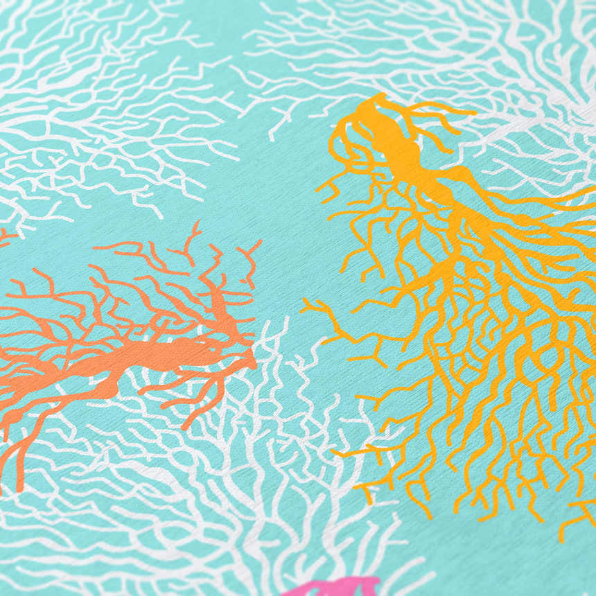 Close-up of Dalyn Seabreeze Teal Washable Area Rug featuring coral design in teal, burnt, off-white, pink, and yellow.