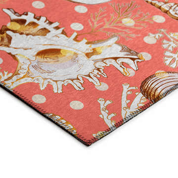 Close-up of Dalyn Seabreeze SZ6 Salmon Washable Area Rug. Features a salmon background with seashell and coral pattern.