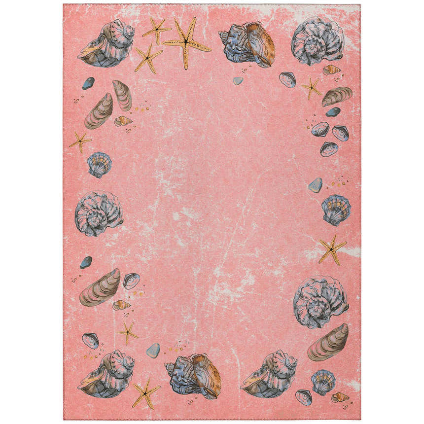 Salmon Seabreeze rug close-up. Coastal design with seashells and starfish on a peach background. Washable, indoor/outdoor.