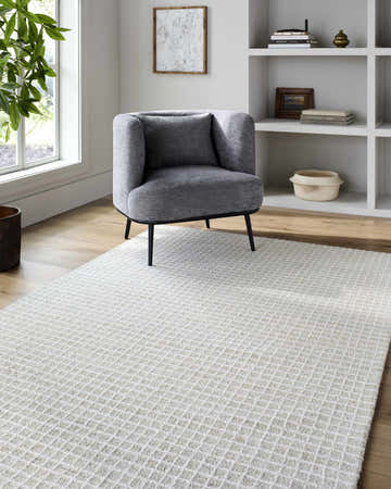 Living room scene with dove gray chair on Andreas Handmade Vivir x LIVABLISS VVAN-2303 wool area rug. Neutral tones. Roomscene-Rectangle