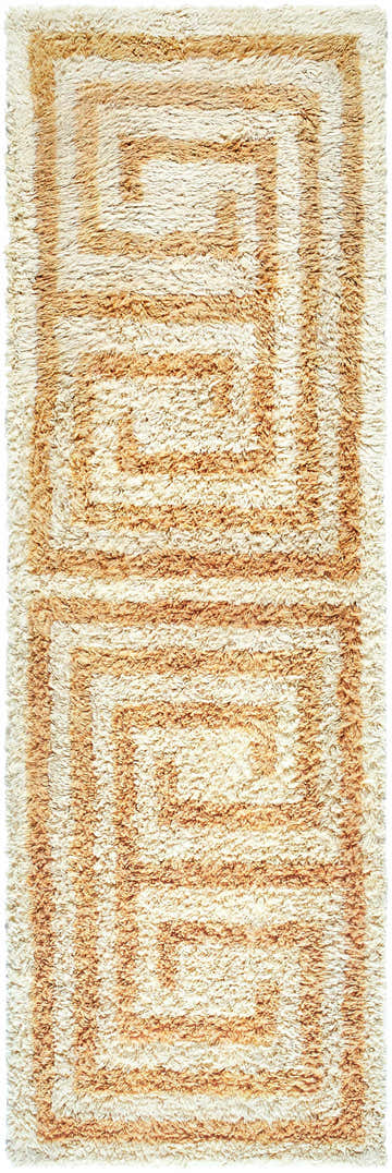 Close-up of the hand-tufted Wasim Area Rug. Brick red, camel, and tan wool rug with a geometric, Southwestern-inspired pattern. Design-Runner-268