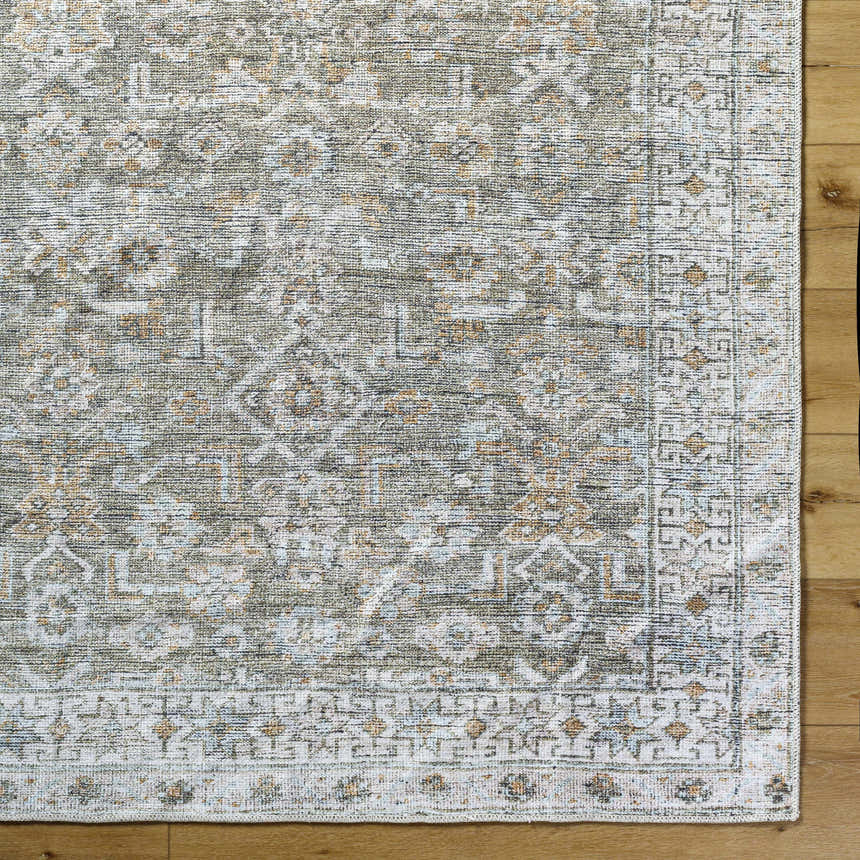 Close-up of the Tisha Washable Area Rug. Farmhouse style rug in gray, silver, and tan with a traditional pattern. Swatch