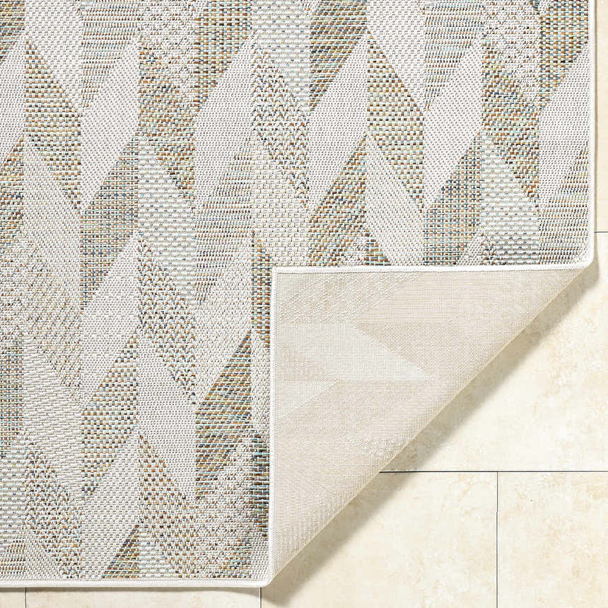 Close-up of Andrea Ivory Area Rug showing geometric pattern, ivory, sage, and sandstone colors, and polypropylene texture. Fold
