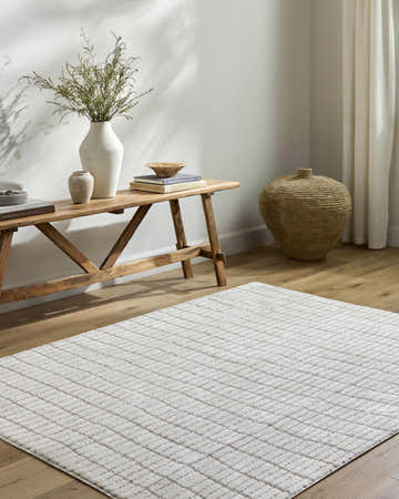 Entryway with Cascade Machine Woven PNW Home x LIVABLISS rug, wood bench, vases, and woven basket. Ivory and taupe tones. Roomscene-Rectangle