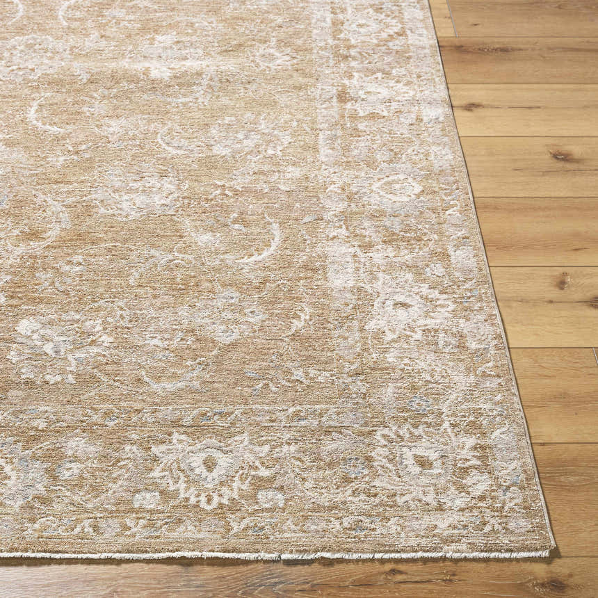 Close-up of the Tylie Tan Area Rug showing cream, light brown, and olive tones with a traditional floral pattern on wood floor. Front