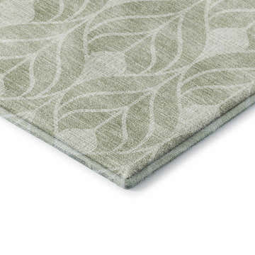 Close-up of Dalyn Luxury The Reserve TR10 Celery Washable Area Rug showing celery and white leaf pattern.
