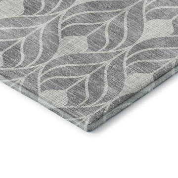 Close-up of the gray Dalyn Luxury The Reserve TR10 rug featuring a geometric leaf pattern. Washable, indoor/outdoor rug.