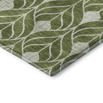 Close-up of the Dalyn Luxury The Reserve TR10 Olive Washable Area Rug, featuring a geometric leaf pattern in olive and beige.