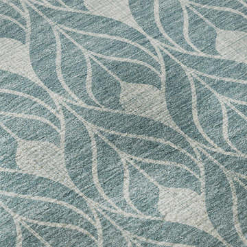 Close-up of Dalyn Luxury Indoor/Outdoor The Reserve TR10 Teal Washable Area Rug with a leaf pattern.