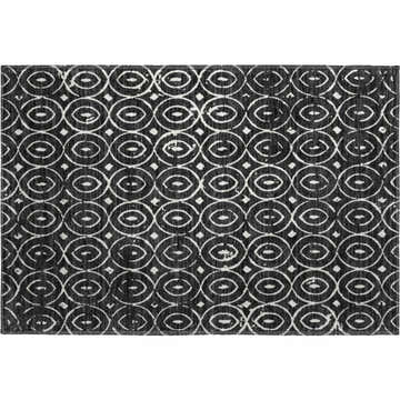 Close-up of Dalyn Luxury The Reserve TR12 Black Washable Area Rug. Black rug with off-white geometric oval pattern.