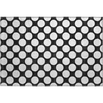 Close-up of Dalyn Luxury The Reserve TR13 Black Washable Area Rug with a black and off white polka dot geometric design.