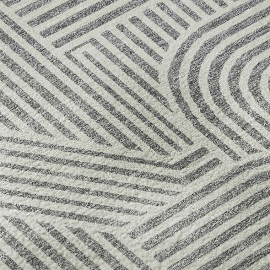 Close up of the Dalyn Luxury The Reserve TR14 Gray Washable Area Rug with a geometric pattern.