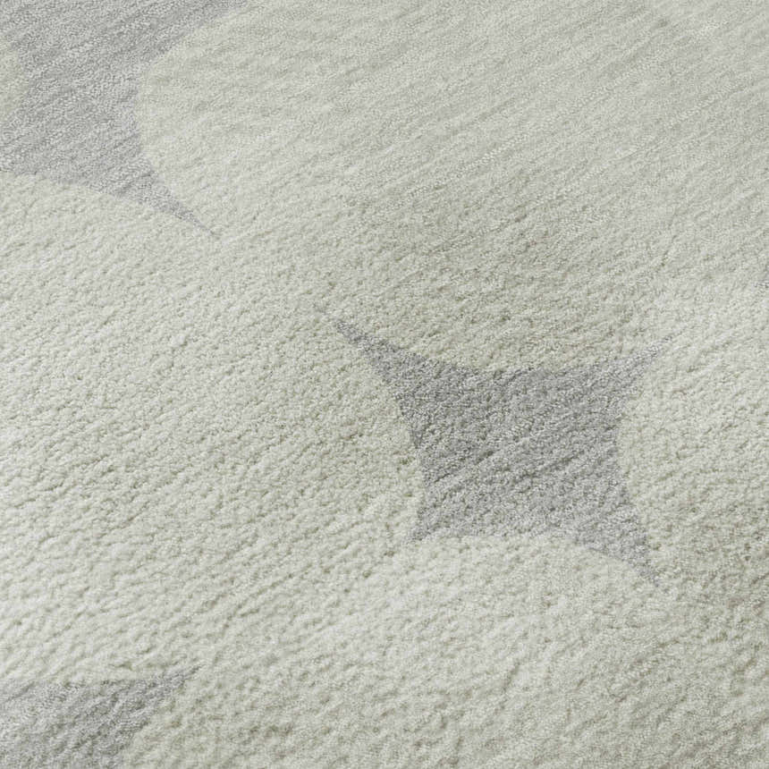 Close-up of the Dalyn Luxury The Reserve TR16 Gray Washable Area Rug, featuring a geometric pattern and soft texture.