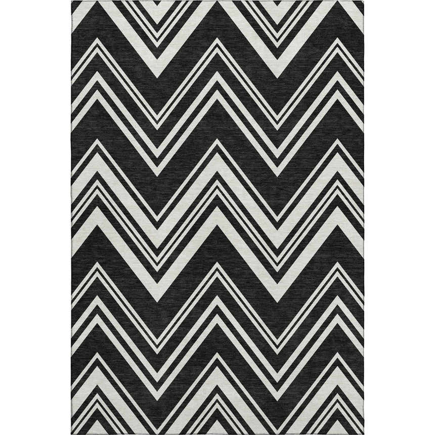 Close-up of Dalyn Luxury The Reserve TR17 Black Washable Area Rug. Black rug with off-white geometric chevron pattern.