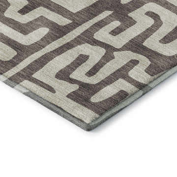 Close-up of Dalyn Luxury The Reserve TR1 Chocolate Washable Area Rug with a brown and beige geometric pattern.