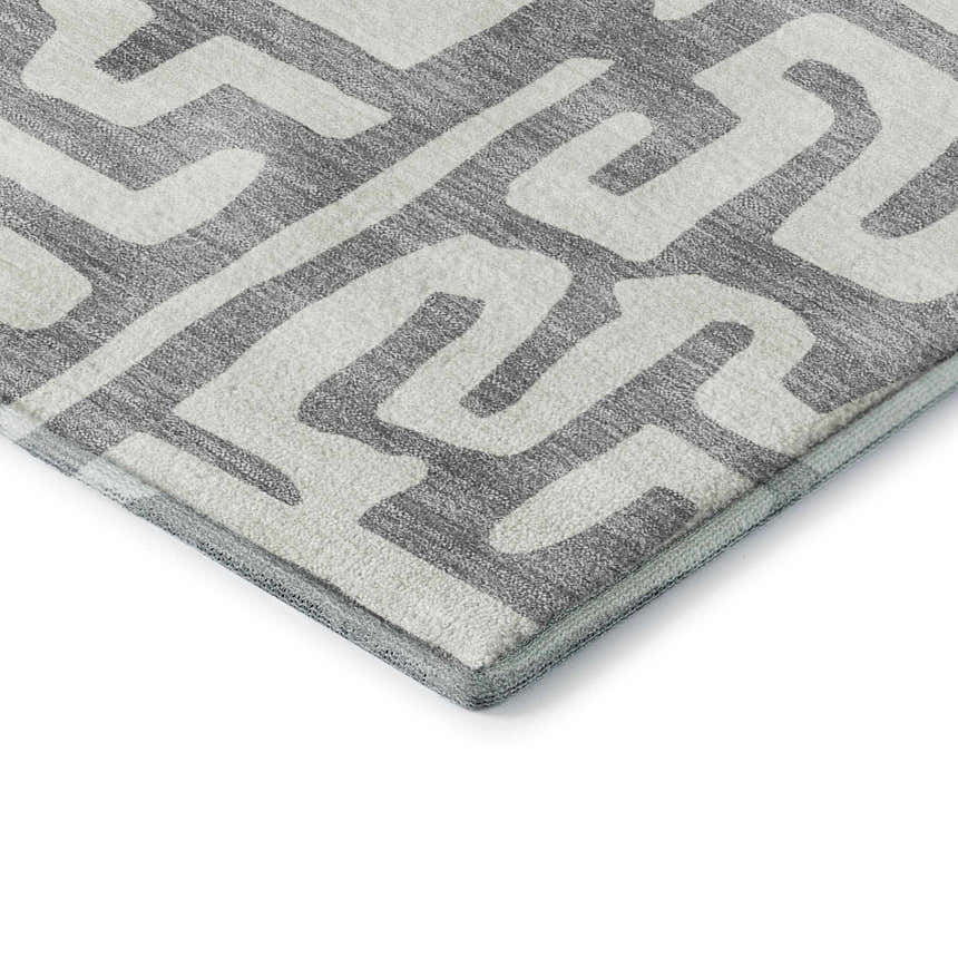 Close-up of Dalyn Luxury The Reserve TR1 Gray Washable Area Rug, featuring a geometric pattern in gray and white.