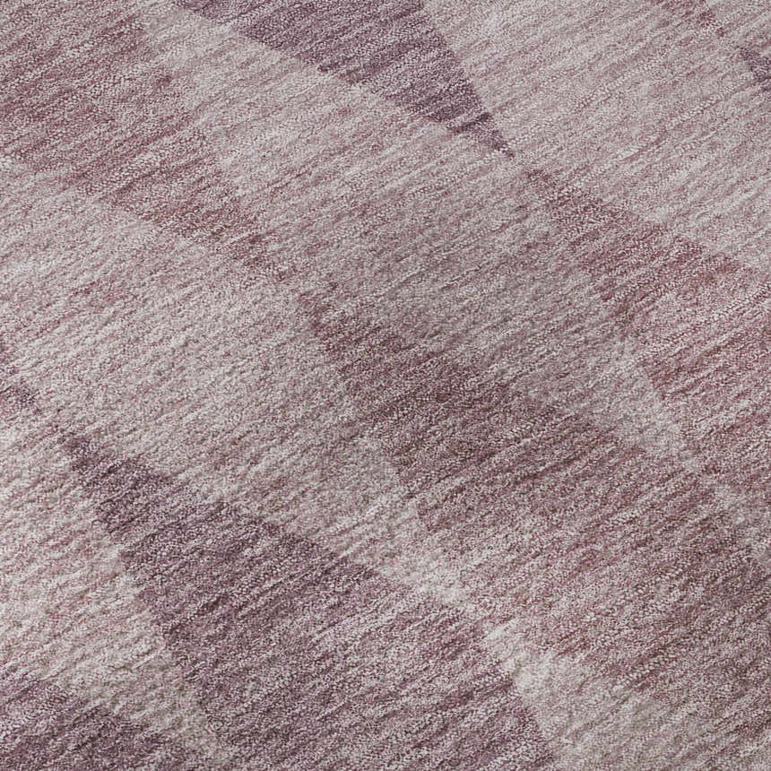 Close-up of the Dalyn Luxury Indoor/Outdoor The Reserve TR2 Blush Washable Area Rug with geometric blush pink and light purple pattern.