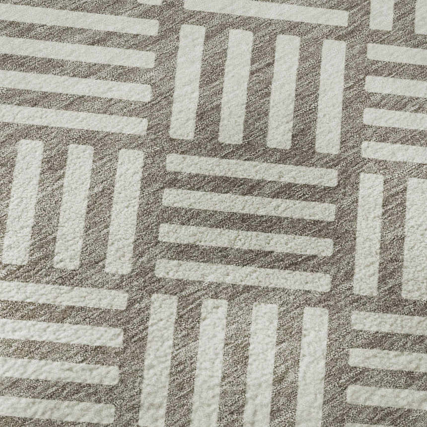 Close up of the Dalyn Luxury The Reserve TR3 Taupe Washable Area Rug, featuring a geometric pattern of ivory bars on a chestnut background.